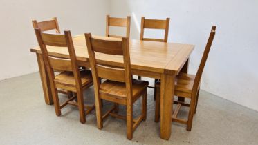 A SOLID OAK EXTENDING DINING TABLE COMPLETE WITH 6 SOLID OAK DINING CHAIRS (CLOSED) 180CM L X 100CM