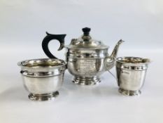 AN ANTIQUE SILVER THREE PIECE TEASET, SHEFFIELD ASSAY E.V. BEARING PRESENTATION INSCRIPTION.