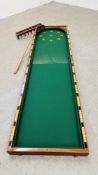 AN EARLY 20TH CENTURY TABLE TOP MAHOGANY BAGATELLE BOARD (CLOSED 107CM) 214CM W 56CM BEARING MAKERS