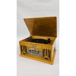 A CLASSIC RETRO STYLE CD, RECORD, RADIO AND CASSETTE PLAYER - SOLD AS SEEN.