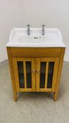 A MODERN FREE STANDING SINK UNIT WITH OAK EFFECT CABINET BASE & HERITAGE SINK.