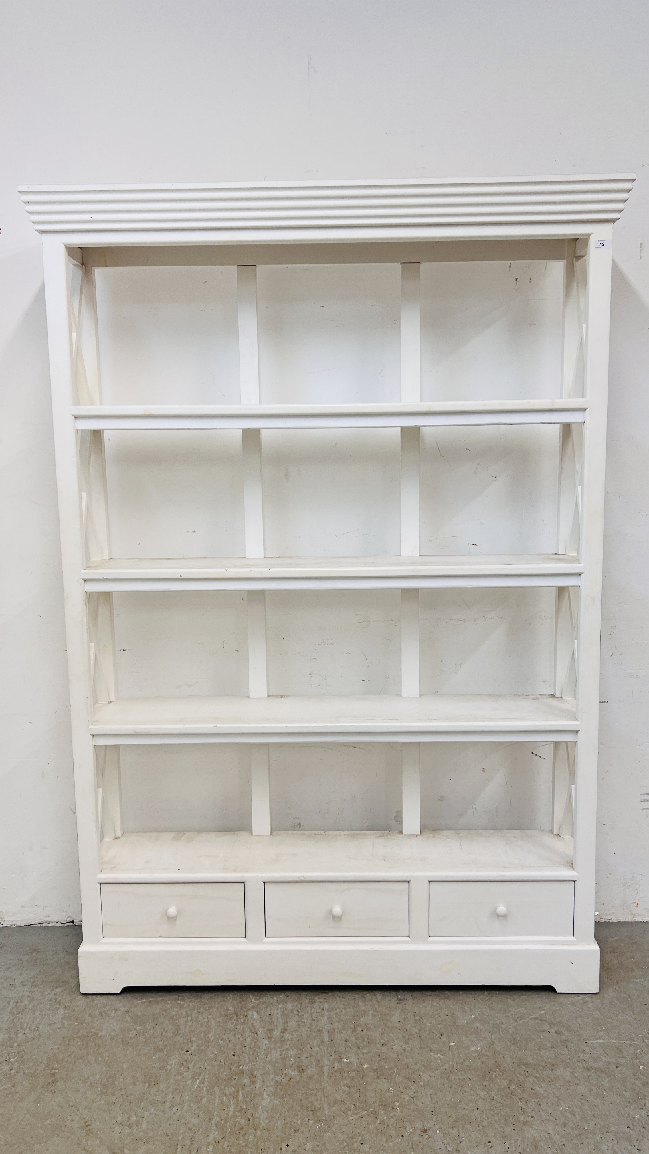 A WHITE PAINTED FOUR TIER BOOKSHELF WITH DRAWERS TO BASE - HEIGHT 200CM. WIDTH 132CM. DEPTH 30CM.