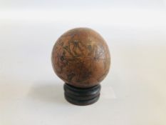 AN ANTIQUE MINIATURE WORLD GLOBE FASHIONED ON A SEED, DIAMETER 5.5CM.