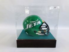 A VINTAGE AMERICAN FOOTBALL RIDDELL "JETS" HELMET IN DISPLAY CASE BEARING SIGNATURE "BROWNING NAGLE