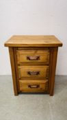 A MODERN WAXED PINE 3 DRAWER BEDSIDE CHEST