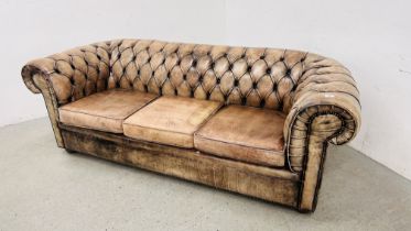 A LEATHER BUTTON BACK CHESTERFIELD SOFA WITH STUD DETAIL.