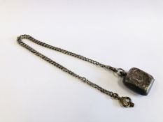 A VINTAGE SILVER SOVEREIGN CASE ATTACHED TO SILVER WATCH CHAIN.