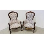 A PAIR OF VICTORIAN STYLE BUTTON BACK NURSING CHAIRS, UPHOLSTERED IN BLUE STRIPED MATERIAL.