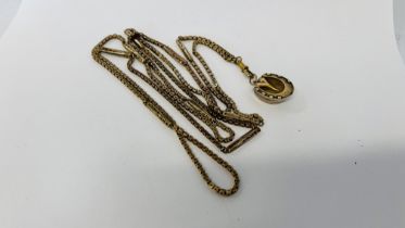 VICTORIAN LONG GUARD CHAIN WITH UNUSUAL HORSE SHOE HINGED LOCKET ATTACHED.