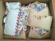 STAMPS: BOX WITH A QUANTITY c1950s ON PAPER SORTED INTO COUNTRIES IN ENVELOPES,
