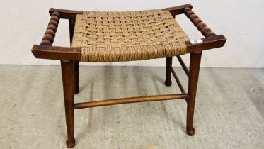 A VINTAGE OAK STOOL WITH A SEAGRASS LATTICE WORK SEAT, TURNED BOBBIN HANDLES W 63CM X D 33CM X H 50.