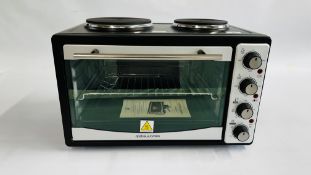 AN ANDREW JONES MINI OVEN - SOLD AS SEEN.