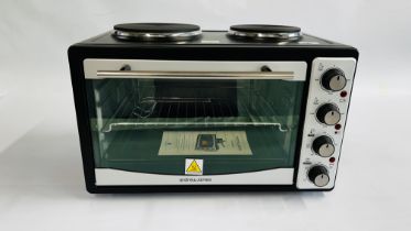 AN ANDREW JONES MINI OVEN - SOLD AS SEEN.