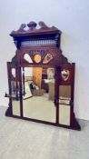 A LARGE VICTORIAN MAHOGANY OVER MANTEL MIRROR HAVING LARGE CENTRAL MIRROR SURROUNDED BY 9 SMALLER