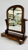 A VICTORIAN MAHOGANY TOILET MIRROR ON BUN FEET.