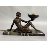 AN ART DECO STYLE RECLINING NUDE FIGURE OF A LADY SET ON HARD STONE BASE - LENGTH 37CM - SOLD AS