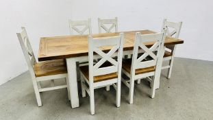 AN OAK TOPPED EXTENDING DINING TABLE - CLOSED 150CM X 90CM,