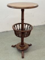 AN ANTIQUE VICTORIAN CIRCULAR LAMP TABLE WITH LOWER CIRCULAR BASKET AND TURNED SUPPORTS ON TRIPOD