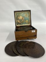 A VINTAGE POLYPHON MUSIC BOX AND 5 PLATES A/F - 1 FOOT MISSING - W 26 X D 23.5 X H 15CM.