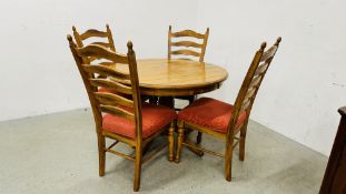 A WAXED PINE CIRCULAR PEDESTAL DINING TABLE COMPLETE WITH 4 LADDER BACK DINING CHAIRS WITH FINIAL