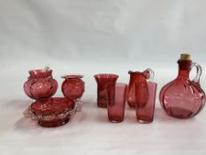 A GROUP OF 8 PIECES OF ASSORTED CRANBERRY GLASS TO INCLUDE A DECANTER JUG, PAIR OF BEAKERS ETC.