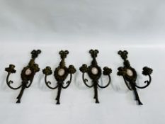 A GROUP OF 4 ELABORATE VINTAGE BRASS TWO BRANCH WALL SCONCES INSET WITH AN OVAL PORCELAIN CAMEO.