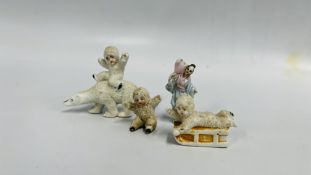 SMALL GROUP OF FOUR VINTAGE CAKE DECORATIONS TO INCLUDE THREE SNOW BABIES AND JAPANESE FIGURE