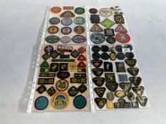 FOUR PAGES OF VINTAGE BADGES RELATING TO SCOUTS, BROWNIES AND GUIDES,