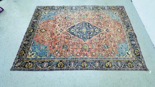 A TRADITIONAL PINK / BLUE PATTERNED EASTERN CARPET 303CM X 207CM.