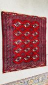 A RED AND BLUE PATTERNED EASTERN RUG - 125 X 108CM.