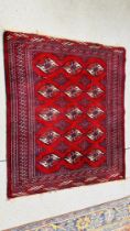 A RED AND BLUE PATTERNED EASTERN RUG - 125 X 108CM.