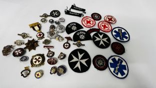 A COLLECTION OF CLOTH AND ENAMELLED BADGES RELATING TO ST. JOHNS AMBULANCE, BRITISH LEGION , ETC.