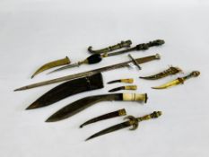 A GROUP OF SIX VINTAGE DAGGERS AND SWORDS TO INCLUDE EASTERN DESIGN, DECORATIVE BRASS,