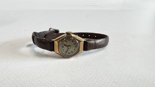 A VINTAGE LADIES WRIST WATCH, THE CASE MARKED "STOLLACE" 375 (9CT GOLD) ON A BROWN LEATHER STRAP.