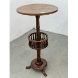 AN ANTIQUE VICTORIAN CIRCULAR LAMP TABLE WITH LOWER CIRCULAR BASKET WITH TURNED SUPPORTS ON A
