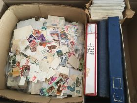 STAMPS: BOX WITH A COLLECTION IN FOUR ALBUMS AND LOOSE, MALAYSIA FIRST DAY COVERS ETC.
