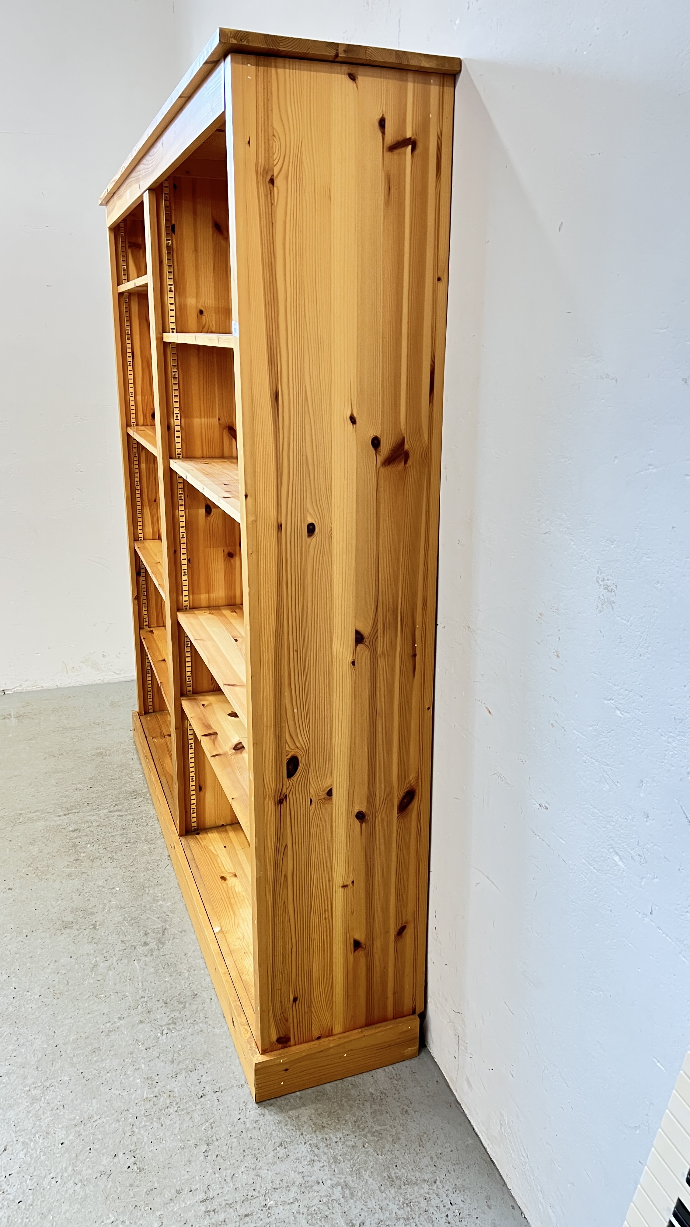 A SOLID PINE DOUBLE BOOKSHELF WITH ADJUSTABLE SHELVES, W 180CM, D 36CM, H 183CM. - Image 5 of 7