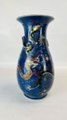 A C19TH CHINESE VASE DECORATED WITH DRAGONS ON A DARK BLUE GROUND,