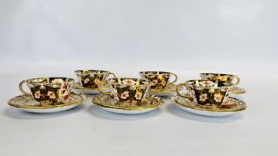ROYAL CROWN DERBY: SIX CUPS AND TWELVE SAUCERS IN IMARI PATTERN C20TH.