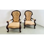 A PAIR OF VICTORIAN MAHOGANY BUTTON BACK LOW ARMCHAIRS - H 99CM.