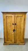 AN ANTIQUE WAXED PINE COUNTRY 2 DOOR LARDER CUPBOARD - W 98CM X D 50CM X H 138CM.