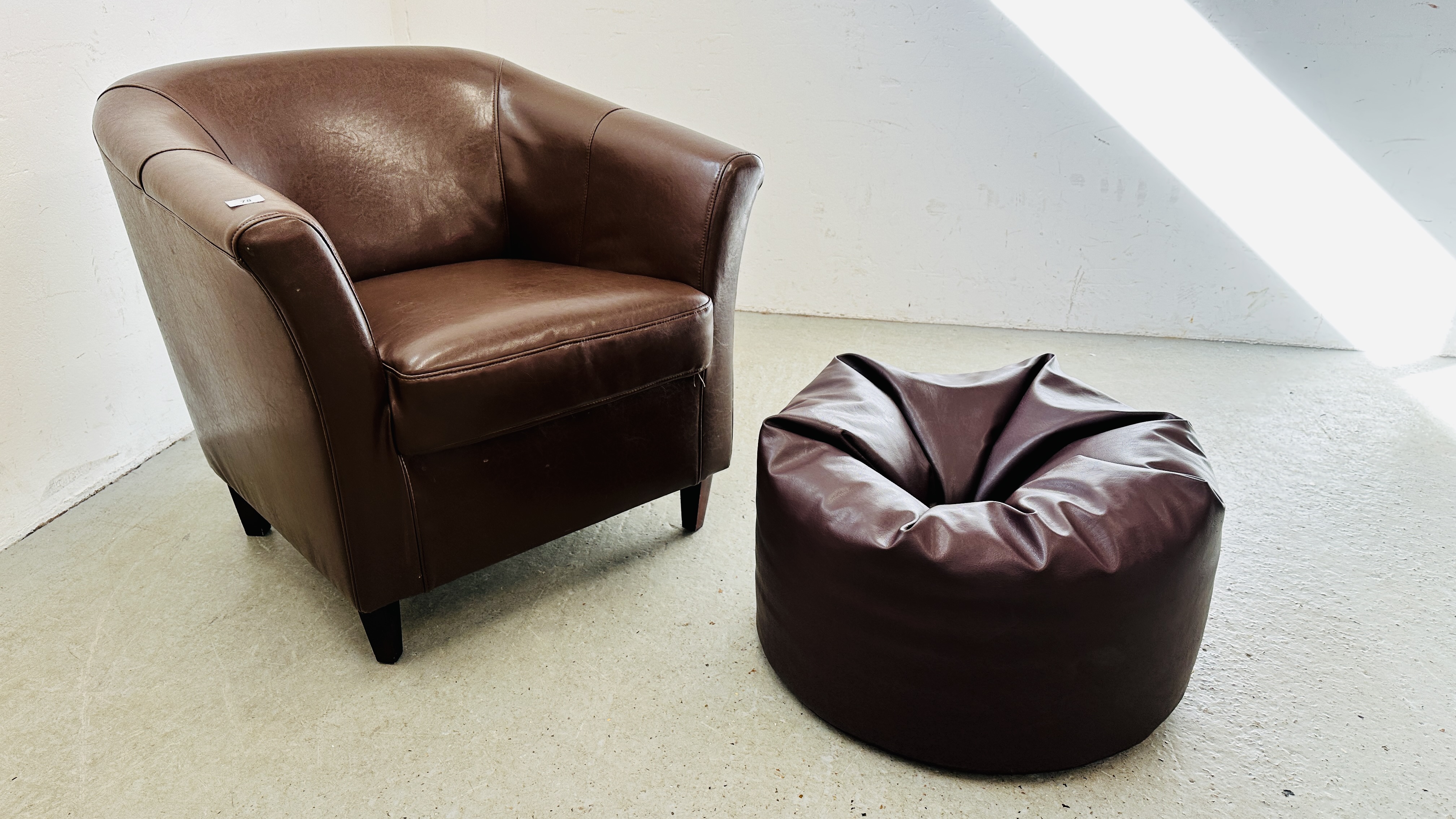 A MODERN BROWN FAUX LEATHER TUB CHAIR ALONG WITH MATCHING BEAN BAG FOOT REST.