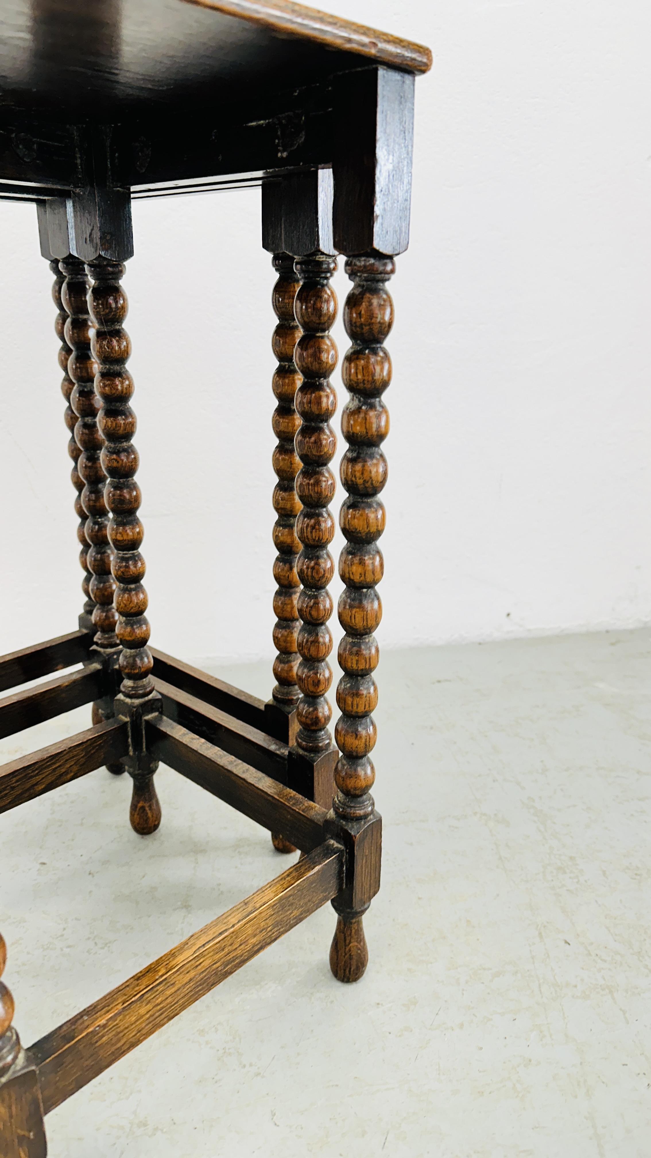 A NEXT TO 3 GRADUATED OCCASIONAL TABLES ON BOBBIN TURNED SUPPORTS - H 55CM X W 42CM X D 30CM. - Image 6 of 9