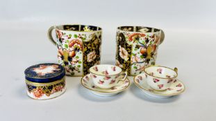 TWO MINIATURE "ROYAL CROWN DERBY" CUP AND SAUCERS,