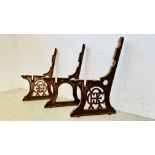 A PAIR OF ANTIQUE GREAT EASTERN RAILWAY DECORATIVE CAST BENCH ENDS AND CENTRE SUPPORT.