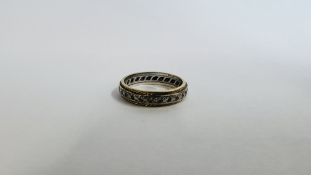 AN 18CT GOLD STONE SET ETERNITY RING.