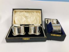 A NAPKIN RING IN CASE, SHEFFIELD 1881 + A PAIR OF NAPKIN RINGS WITH WAVY EDGES, BIRMINGHAM 1926,