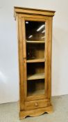 AN ANTIQUE PITCH PINE SINGLE GLAZED DOOR CABINET WITH DRAWER BELOW - W 69CM X D 40CM X H 187CM.