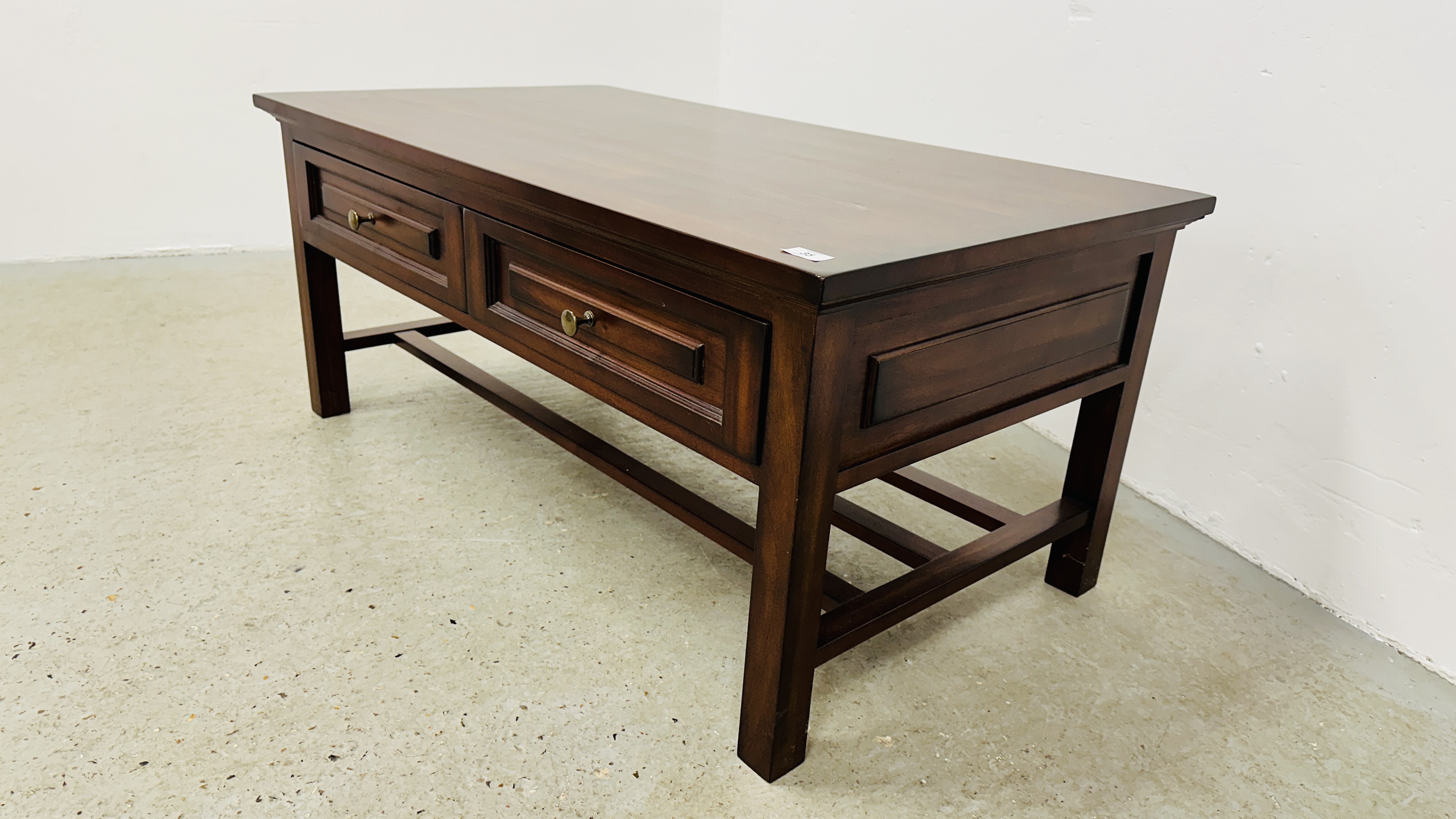 A DARK WOOD TWO DRAWER RECTANGULAR COFFEE TABLE - 110CM X 60CM. - Image 9 of 9