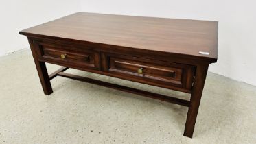 A DARK WOOD TWO DRAWER RECTANGULAR COFFEE TABLE - 110CM X 60CM.